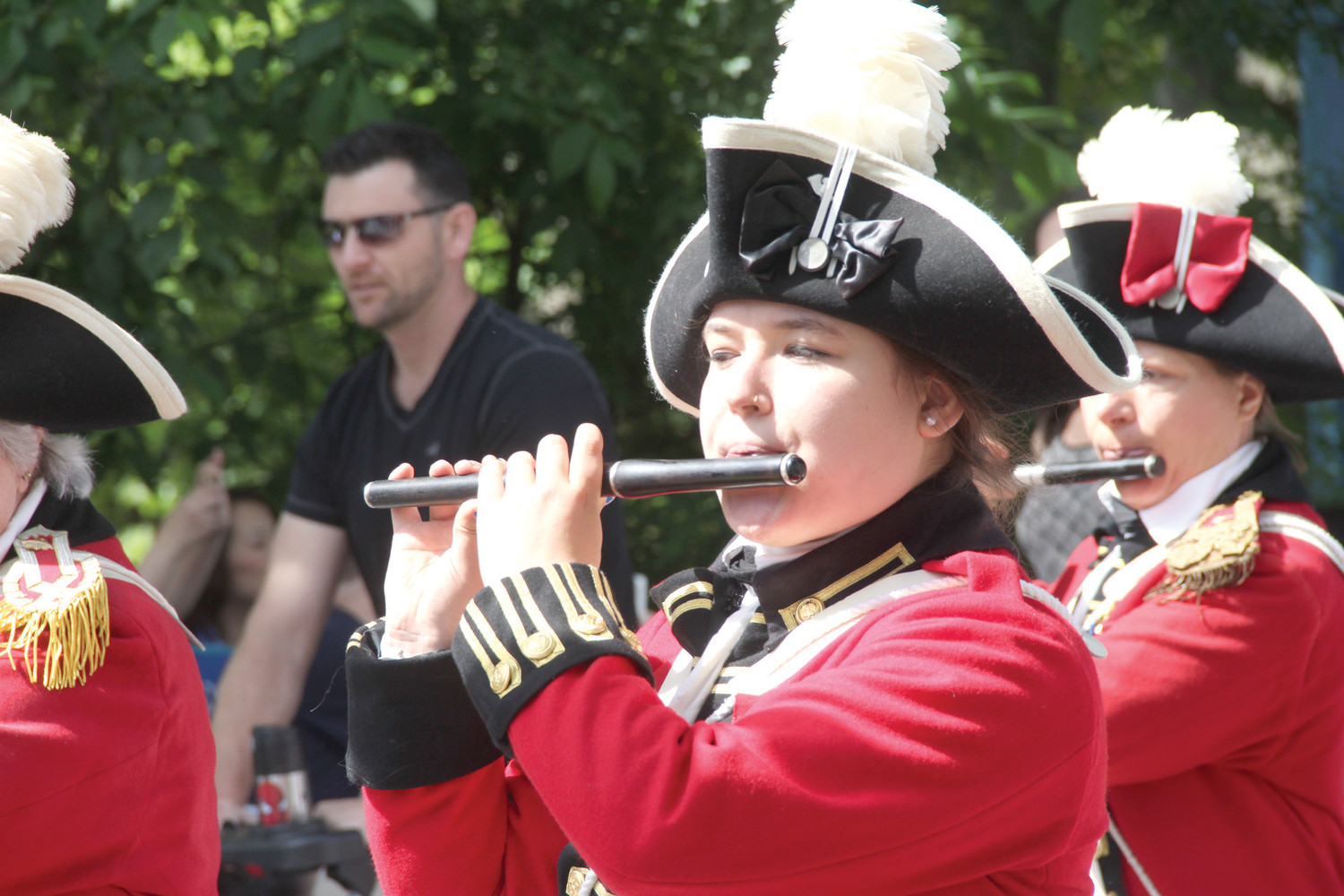 Alyssa Dubis plays with the Pawtuxet Rangers that led the parade Saturday down Narragansett Parkway to Broad Street in Cranston.